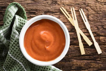 Homemade fry sauce made of ketchup and mayonnaise in bowl, photographed overhead (Selective Focus,...