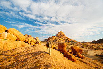 Young girl hiking in Spitzkoppe Namibia