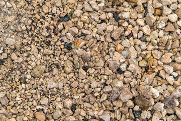 textured pebbles in a light neutral color