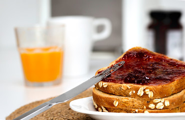Slices of bread with toast bread with homemade strawberry jam for breakfast