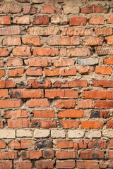 textured, expressive wall of red bricks