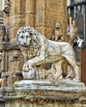 One of the Medici lions. The sculpture depicts standing male lion with a sphere or ball under one paw, looking to the side. The lions have been copied & publicly installed in over 30 other locations.