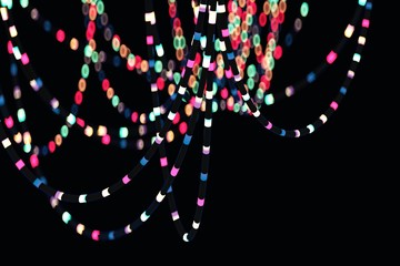 Blurred bokeh of party hanging lightining colorful wire garland. 3D Illustration