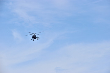 helicopter in flight, blue sky