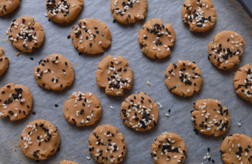 Sesame cookies on baking tray