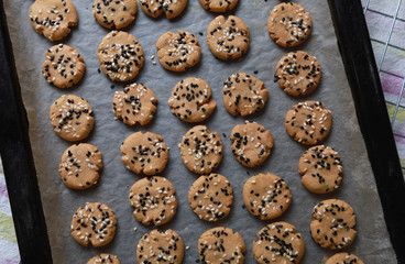 Sesame cookies on baking tray