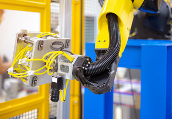 Automation concept: View of robot glass sealing with vision system in automatic line