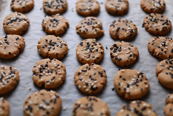 Sesame cookies on baking tray