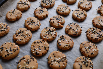 Sesame cookies on baking tray