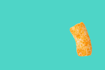Rod Snack tube isolated on green background with space for copy.