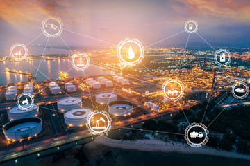 Light oil refinery at twilight with physical system icons diagram on industrial factory. Industry on technology 4.0 concept support with double exposure.