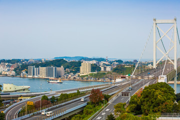Fototapeta na wymiar Kanmon strait and Kanmonkyo Bridge:Kanmonkyo Bridge connects Honshu and Kyushu in Japan.