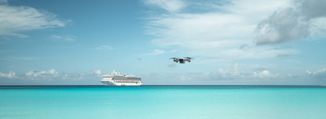Drone in the flight on the beautiful sandy beach with ship on the back Bahamas 