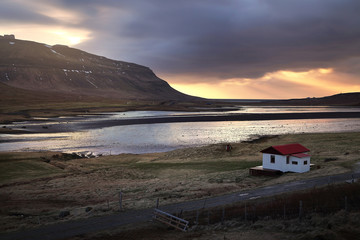 Beautiful scenery of natural from meadow and mountains during sunset in Iceland.