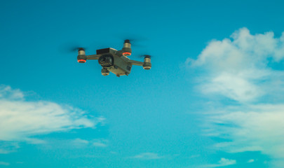 Fototapeta na wymiar Small Drone on the blue sky 