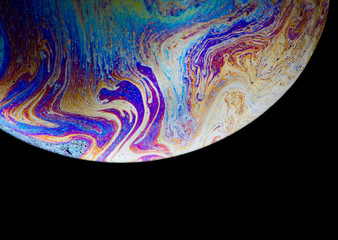 Soap bubble photography as seen on iphone wallpaper, unique colorful elements with black background making footage awesome, very highly photograph good shutter speed to capture those vibrant colors.