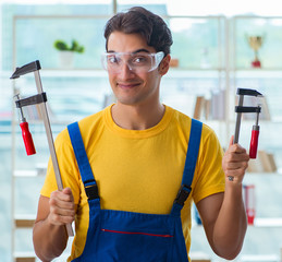 Furniture carpenter working in the workshop