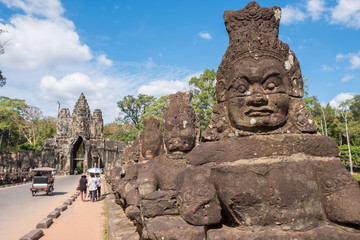 Rows of demons statue along the bridge way to gate of Angkor Thom the last and most enduring capital city of the Khmer empire in Siem Reap, Cambodia.