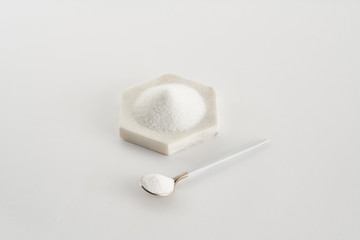 brown and white sugar in the spoon