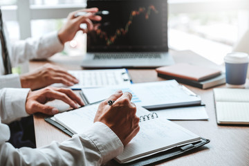 Business Team meeting Investment and Entrepreneur Trading Stock Market and Exchange discussing and analysis graph