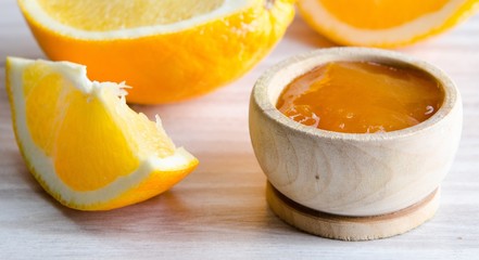 Fototapeta na wymiar Orange jam served in spoon on the table