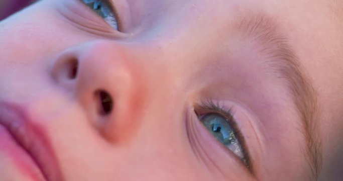 Macro portrait of a beautiful, blue-eyed, little girl