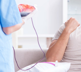 Patient getting blood transfusion in hospital clinic