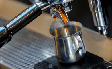 Espresso pouring from coffee machine