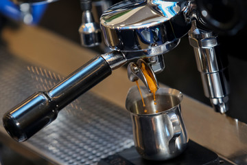 Espresso pouring from coffee machine