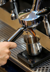 Espresso pouring from coffee machine