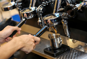 Espresso pouring from coffee machine