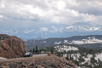 Dramatic clouds and snow views on scenic Beartooth Highway in early summer