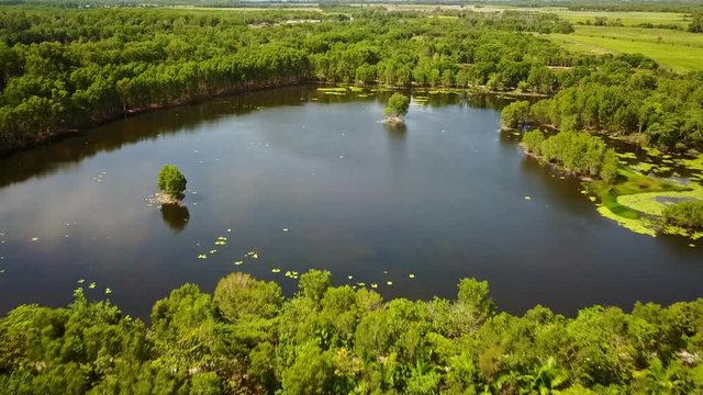 Low and then rising aerial footage of the Cattana Wetlands at Smithfield, near Cairns, Queensland, Australia. August 2018.