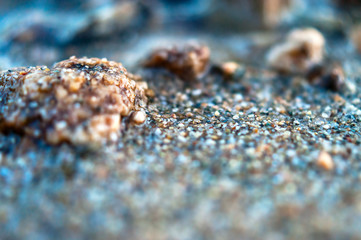 Close-up View of Wet Coarse Sand. Travel Concept.