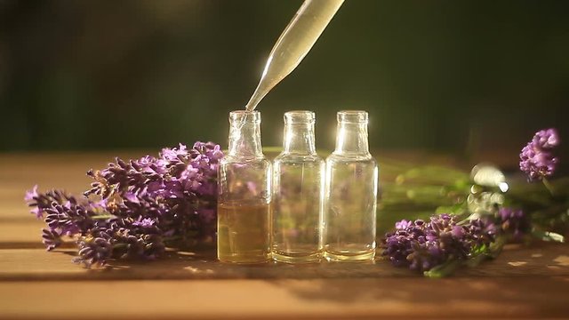 lavender essential oil in  beautiful bottle on table