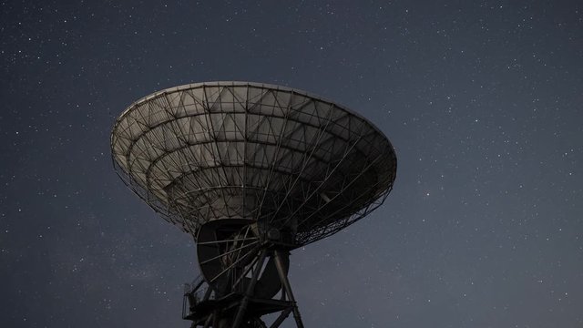 Milky Way Rising over a Radio Telescope (time lapse/tilt up)