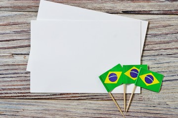 September 7 Brazilian independence Day, the concept of independence , patriotism and freedom. Mini paper flags with white postcards on wooden background. horizontal