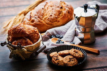 Miscellaneous delicious pastry and coffee pot on the wooden table - 279740238