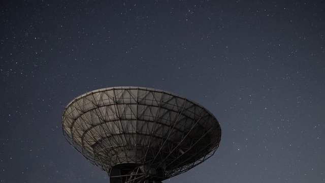 Milky Way Rising over a Radio Telescope (time lapse/tilt down)