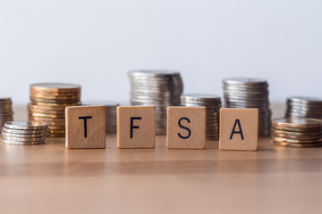 TFSA (Tax Free Saving Accounts) signs with coins in the background