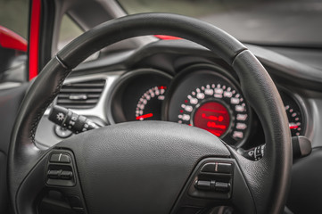 Car interior with steering wheel and dashboard
