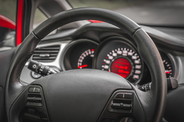Obraz na płótnie Canvas Car interior with steering wheel and dashboard