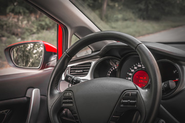 Fototapeta na wymiar Car interior with steering wheel and dashboard