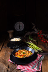colorful turkey fricassee with asparagus and paprika