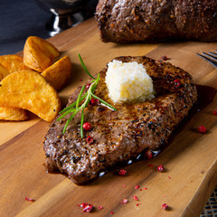 Butter Beef Steak with herbs and potato wedges