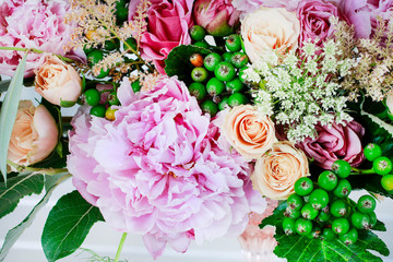 Beautiful bouquet with peonies, roses and Queen Anne's lace flowers.