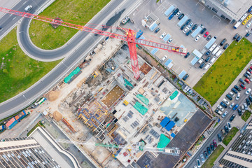 Construction of a high-rise building in the business district of the city, aerial view.