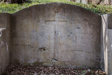 stone slab with a large gravestone cross  in the cemetery