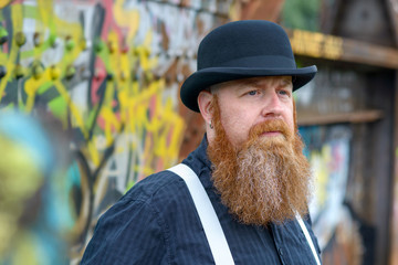 Thoughtful serious man in a bowler hat