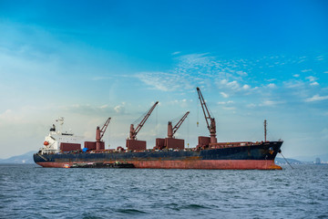 Naklejka premium A cargo ship or freighter ship on sea in Thailand. International trade.